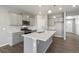 Modern kitchen with an island, stainless steel appliances, and gray cabinets at 27746 E Byers Pl, Aurora, CO 80018