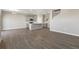Open kitchen with grey cabinets, an island, and stainless steel appliances at 27746 E Byers Pl, Aurora, CO 80018