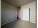 Cozy bedroom with neutral carpet and a closet, offering a comfortable and private retreat at 48280 Shetland Dr, Bennett, CO 80102