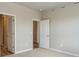 Bedroom with neutral walls, carpeted flooring, and multiple closets at 48280 Shetland Dr, Bennett, CO 80102