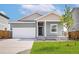 Charming single-Gathering home with a two-car garage and well-manicured lawn at 48280 Shetland Dr, Bennett, CO 80102