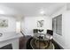 Inviting dining area with modern table set, ideal for intimate meals and gatherings by a bright window at 4779 White Rock Cir # B, Boulder, CO 80301