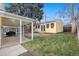 Spacious backyard with lawn, patio, covered patio area and detached office at 3333 W Hayward Pl, Denver, CO 80211