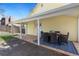 Backyard with covered patio offering outdoor dining space, flagstone and gravel at 3333 W Hayward Pl, Denver, CO 80211