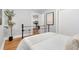 Tranquil bedroom with vintage-inspired bed frame and ample natural light at 3333 W Hayward Pl, Denver, CO 80211
