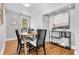 Cozy dining room with round table, stylish chairs, and elegant decor at 3333 W Hayward Pl, Denver, CO 80211