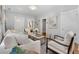 Spacious living room with hardwood floors, a neutral color palette, and seamless transitions to other rooms at 3333 W Hayward Pl, Denver, CO 80211