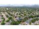 Extensive aerial view of the residential area showcasing tree-lined streets and neighborhood layout at 9758 Red Oakes Dr, Highlands Ranch, CO 80126