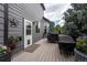 Spacious back deck with grills and outdoor decor, perfect for entertaining at 9758 Red Oakes Dr, Highlands Ranch, CO 80126