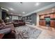 Finished basement featuring a kitchenette, recessed lighting, and a cozy seating area at 9758 Red Oakes Dr, Highlands Ranch, CO 80126