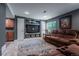 Cozy basement living room with plush seating, built-ins, and recessed lighting at 9758 Red Oakes Dr, Highlands Ranch, CO 80126