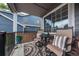 Relaxing front porch with comfortable seating and decorative outdoor rug at 9758 Red Oakes Dr, Highlands Ranch, CO 80126