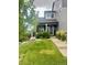 Inviting home with a charming front porch and a well-maintained lawn at 9758 Red Oakes Dr, Highlands Ranch, CO 80126