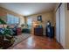 A bright office with two windows and ample natural light, featuring hardwood flooring at 9758 Red Oakes Dr, Highlands Ranch, CO 80126
