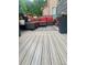 Relaxing outdoor deck area with stylish seating arrangements and patterned rug at 9758 Red Oakes Dr, Highlands Ranch, CO 80126