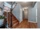 Inviting staircase featuring wood steps, iron railings, and ample natural light at 9758 Red Oakes Dr, Highlands Ranch, CO 80126