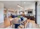 Open-concept dining area with access to the kitchen and living room, perfect for entertaining at 8864 S Quemoy Ct, Aurora, CO 80016