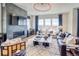 Inviting living room with fireplace, ample natural light, and tasteful decor at 8864 S Quemoy Ct, Aurora, CO 80016
