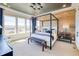 Spacious main bedroom with wood accent wall and large windows at 8864 S Quemoy Ct, Aurora, CO 80016
