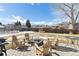 Backyard patio with seating, a fire pit, and a grill, perfect for outdoor entertaining at 4879 S Xenophon St, Morrison, CO 80465