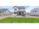 A spacious backyard offers outdoor seating and a well-manicured lawn at 1168 Elbridge Dr, Elizabeth, CO 80107