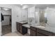 Modern bathroom boasts dual sinks with granite countertops and a glass-enclosed shower at 1168 Elbridge Dr, Elizabeth, CO 80107
