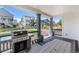 Enjoy outdoor cooking with a stainless steel grill and dining area on the covered patio with views of the landscaped community at 1168 Elbridge Dr, Elizabeth, CO 80107