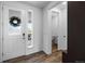 Bright and airy entryway featuring wood floors and a view to the front porch at 1168 Elbridge Dr, Elizabeth, CO 80107