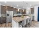 Modern kitchen featuring a large island with granite countertops and stainless steel appliances at 1168 Elbridge Dr, Elizabeth, CO 80107