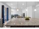 Open concept living area, with eat in kitchen, and kitchen island at 1168 Elbridge Dr, Elizabeth, CO 80107