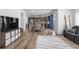 Open living space features a modern kitchen, comfortable sofa and stylish flooring at 1168 Elbridge Dr, Elizabeth, CO 80107