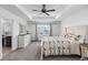 Comfortable bedroom with ceiling fan, stylish bedding, and ample natural light at 1168 Elbridge Dr, Elizabeth, CO 80107