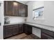Walk-in pantry with counter space, cabinets, and natural light from window at 1168 Elbridge Dr, Elizabeth, CO 80107
