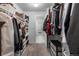 Spacious walk-in closet with carpeted floors, custom shelving, and plentiful clothing storage options at 1168 Elbridge Dr, Elizabeth, CO 80107
