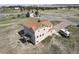 Two-story house with a deck and RV parking, surrounded by a large grassy lot at 40900 Red Fox Cir, Elizabeth, CO 80107