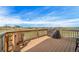 Outdoor deck with wooden railings and ample space to enjoy outdoor living and the surrounding scenery at 40900 Red Fox Cir, Elizabeth, CO 80107