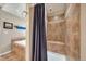 Updated bathroom featuring tile shower, and tub with stylish shower curtain at 40900 Red Fox Cir, Elizabeth, CO 80107
