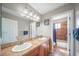 Spacious bathroom featuring double sinks, tile countertops, and access to shower/tub area at 40900 Red Fox Cir, Elizabeth, CO 80107