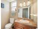 Cozy bathroom featuring a single sink with wood cabinets and a decorative tile countertop at 40900 Red Fox Cir, Elizabeth, CO 80107