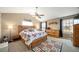 Comfortable bedroom with ceiling fan, natural light, and warm inviting atmosphere at 40900 Red Fox Cir, Elizabeth, CO 80107