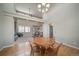 Inviting dining room with high ceilings, hardwood floors, and views into the cozy living spaces at 40900 Red Fox Cir, Elizabeth, CO 80107