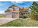 Inviting two-story home with a three-car garage and charming front porch at 40900 Red Fox Cir, Elizabeth, CO 80107