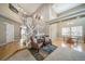 Grand foyer with high ceilings, hardwood floors, staircase, and natural light streaming through large windows at 40900 Red Fox Cir, Elizabeth, CO 80107