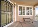 Charming front porch with bench seating, secure front door and window providing ample light at 40900 Red Fox Cir, Elizabeth, CO 80107