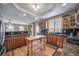 Beautiful kitchen with ample counter space, wooden cabinets and hardwood floors at 40900 Red Fox Cir, Elizabeth, CO 80107