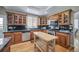 Well-equipped kitchen featuring wooden cabinets, stainless steel appliances, and a functional center island at 40900 Red Fox Cir, Elizabeth, CO 80107