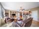 Open living room with hardwood floors, a ceiling fan, access to a kitchen and lots of natural light at 40900 Red Fox Cir, Elizabeth, CO 80107