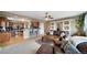 Spacious living room featuring a ceiling fan, and a comfortable leather sofa, open to the kitchen at 40900 Red Fox Cir, Elizabeth, CO 80107