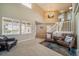 Spacious living room with high ceilings, neutral walls, and comfortable leather seating area at 40900 Red Fox Cir, Elizabeth, CO 80107