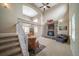 Inviting living room with a stone fireplace, vaulted ceilings and lots of natural light at 40900 Red Fox Cir, Elizabeth, CO 80107